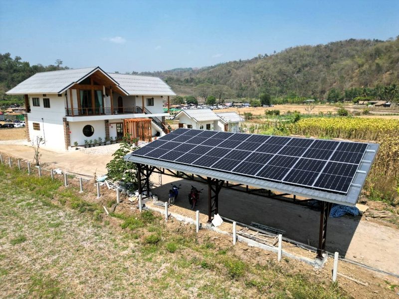 Ground-mounted array in front of the farmhouse